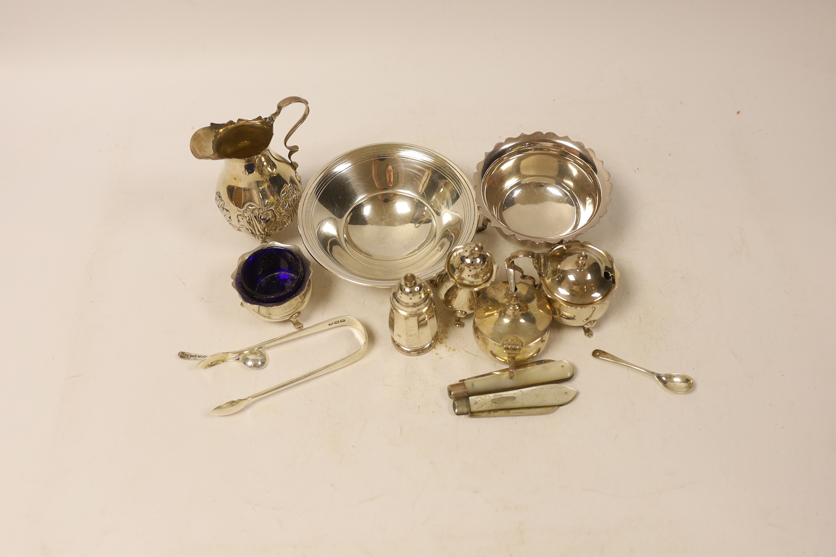 Sundry small silver including two bowls, a late Victorian cream jug, four assorted condiments, two fruit knives and a pair of sugar tongs.